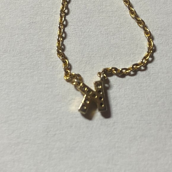 Tiny diamond accents initial K charm connected to a gold finished chain - Picture 6 of 6